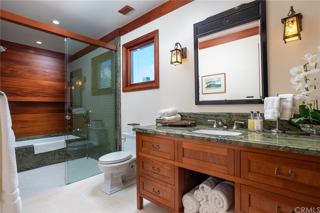 35475 Beach Road Dana Point, CA 92624 - Photo 31 of 59 a bathroom with a granite countertop toilet sink and mirror