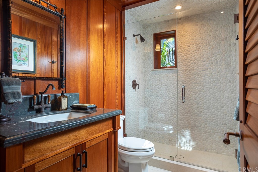 35475 Beach Road Dana Point, CA 92624 - Photo 39 of 59 a bathroom with a sink a toilet and shower