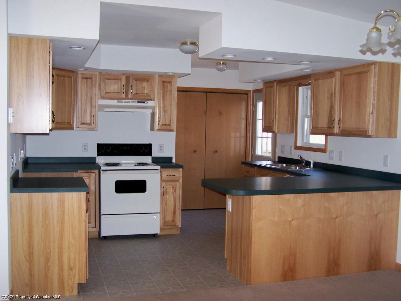 180 Niemchik Road Hunlock Creek, PA 18621 - Photo 3 of 16 a kitchen with a stove and a white refrigerator