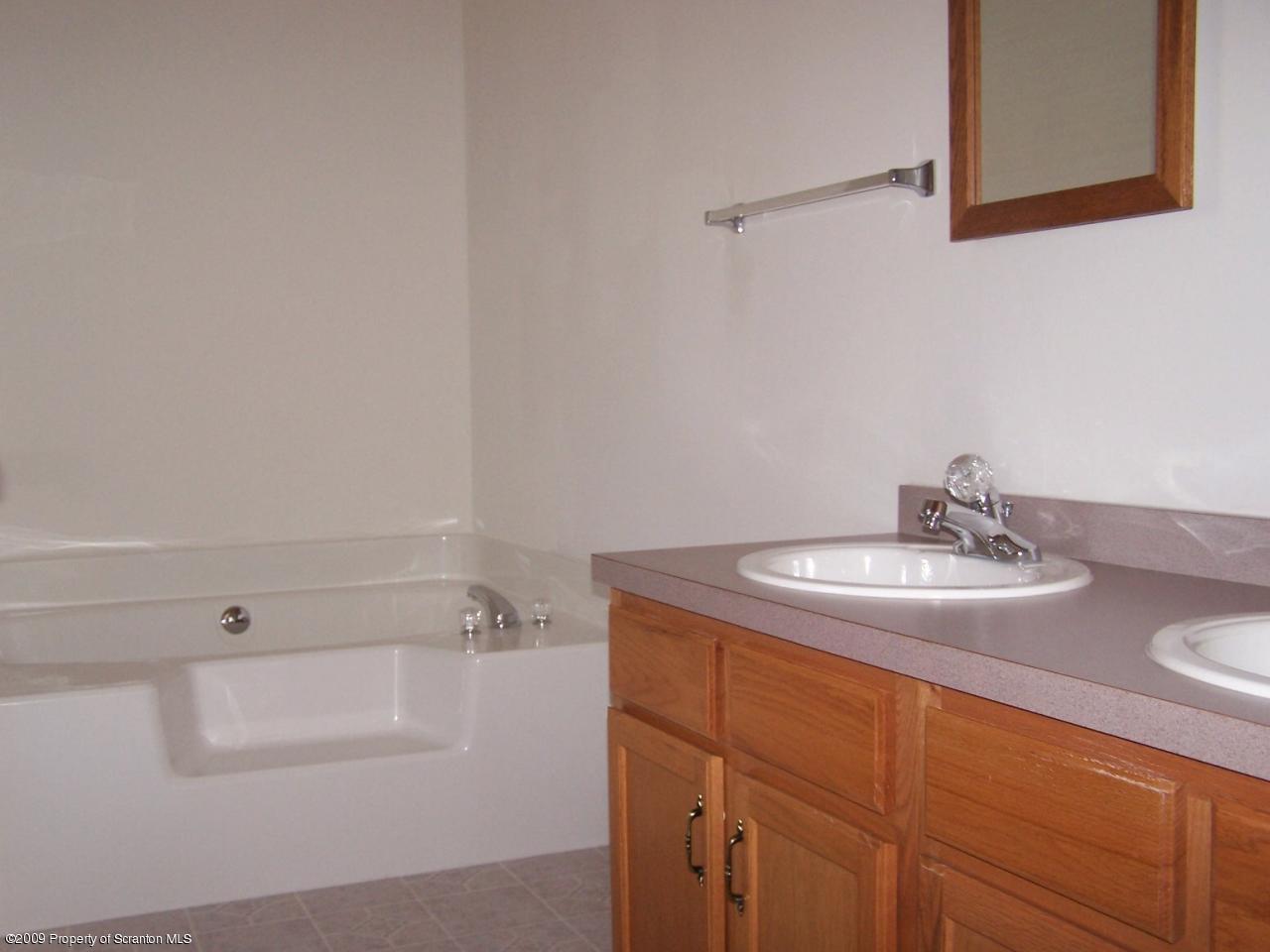 180 Niemchik Road Hunlock Creek, PA 18621 - Photo 7 of 16 a bathroom with a sink and a mirror
