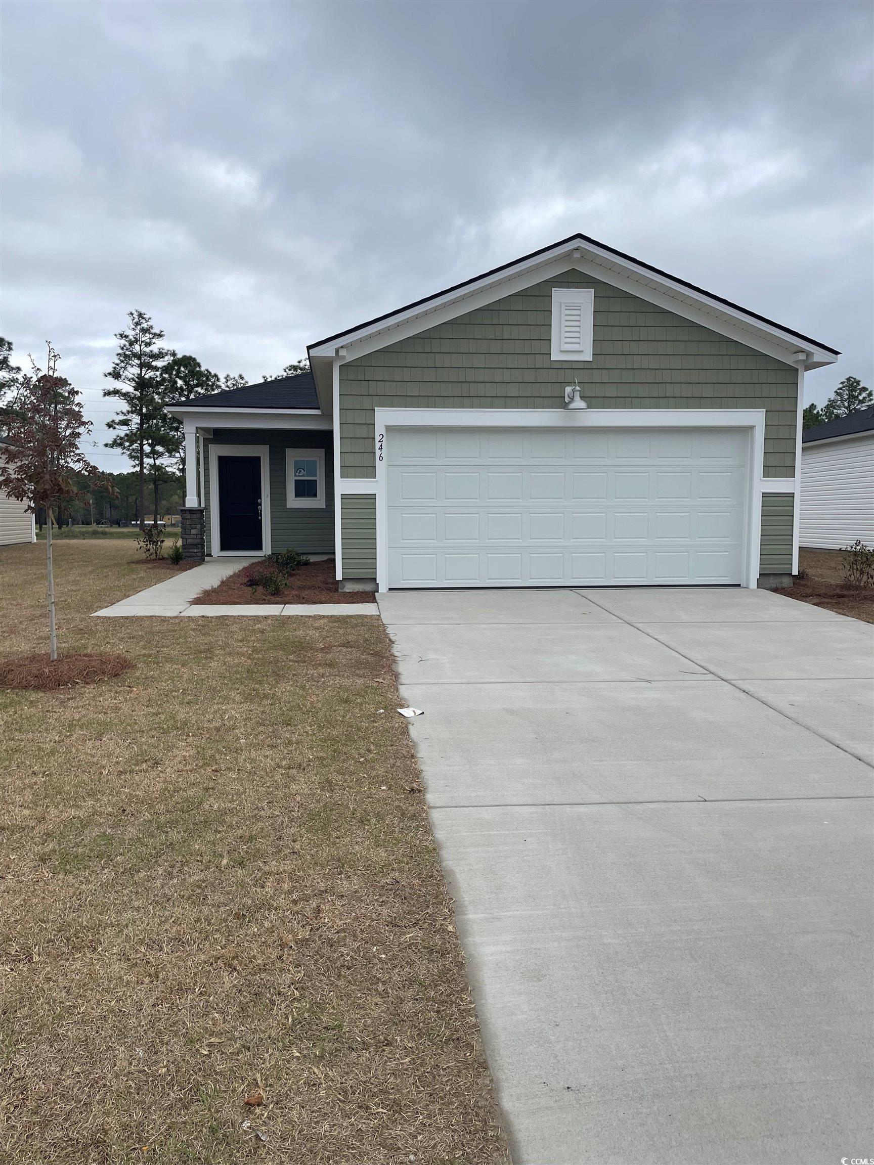246 Warner Xing Way Loris, SC 29569 - Photo 1 of 20 View of front of home with a front lawn, an attach