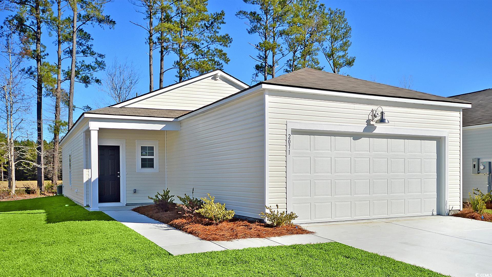 246 Warner Xing Way Loris, SC 29569 - Photo 2 of 20 Single story home featuring a garage and a front l