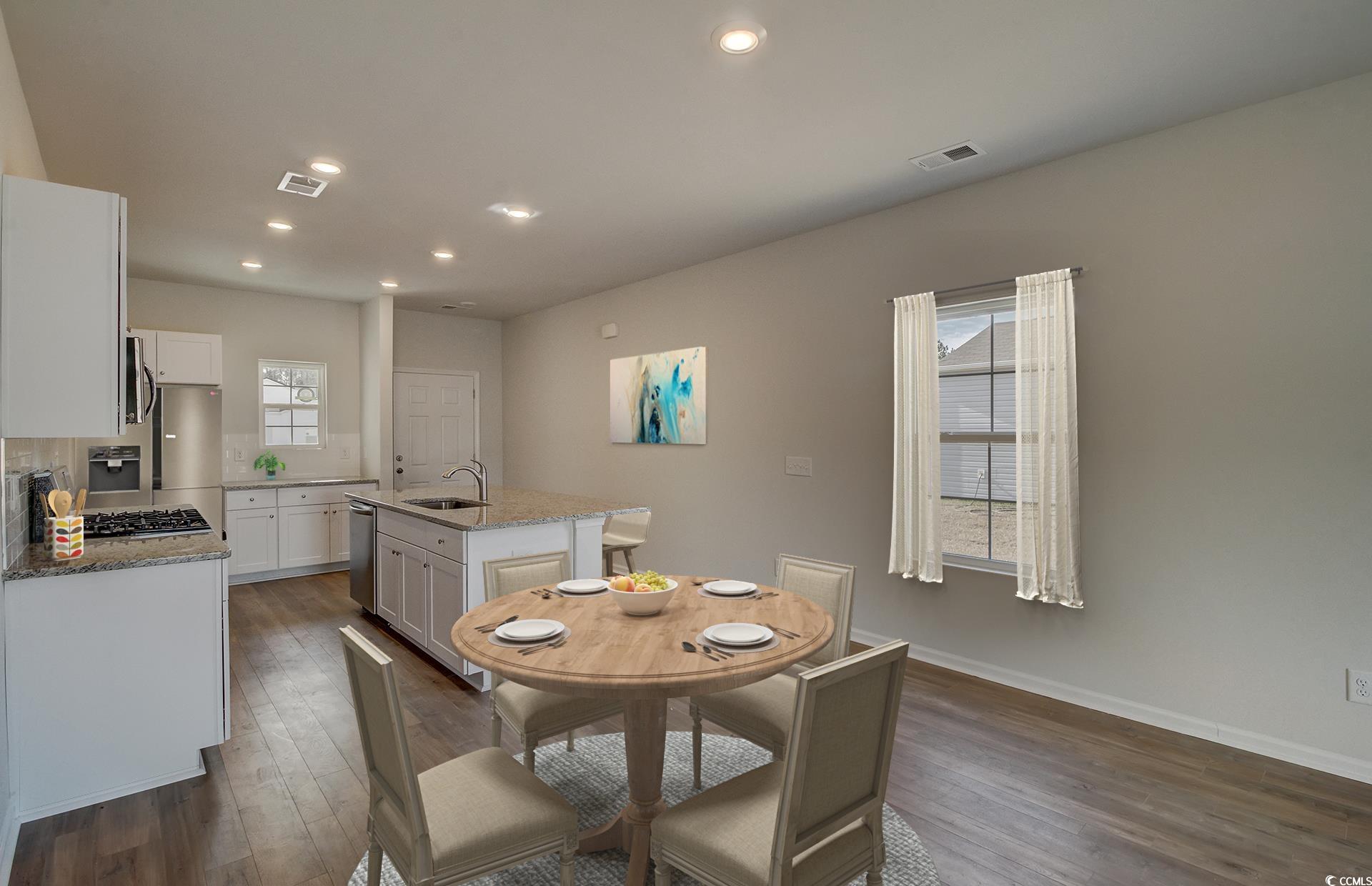 246 Warner Xing Way Loris, SC 29569 - Photo 4 of 20 Dining space featuring dark wood-type flooring and