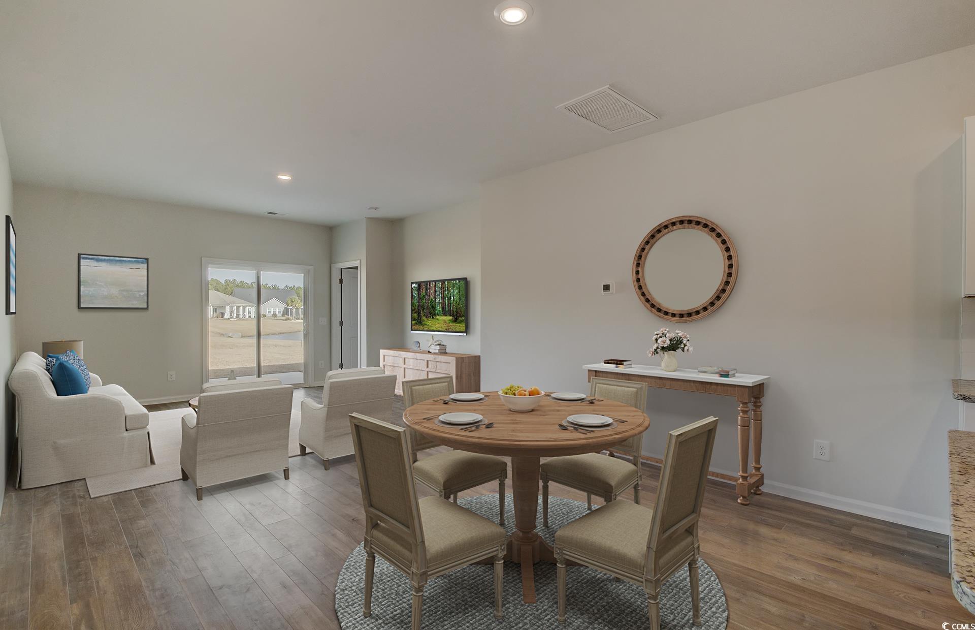 246 Warner Xing Way Loris, SC 29569 - Photo 5 of 20 Dining room with light hardwood / wood-style floor