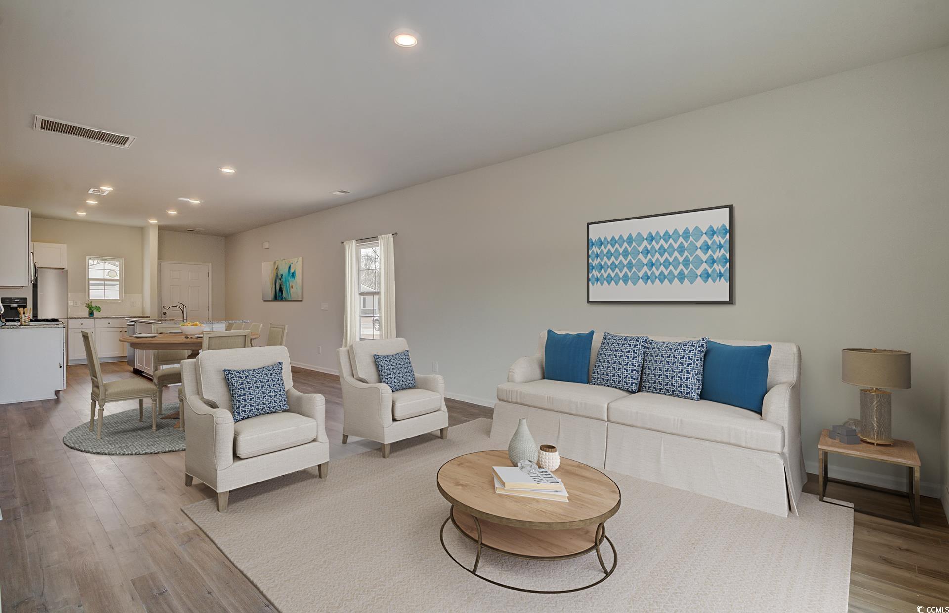 246 Warner Xing Way Loris, SC 29569 - Photo 6 of 20 Living room featuring light hardwood / wood-style