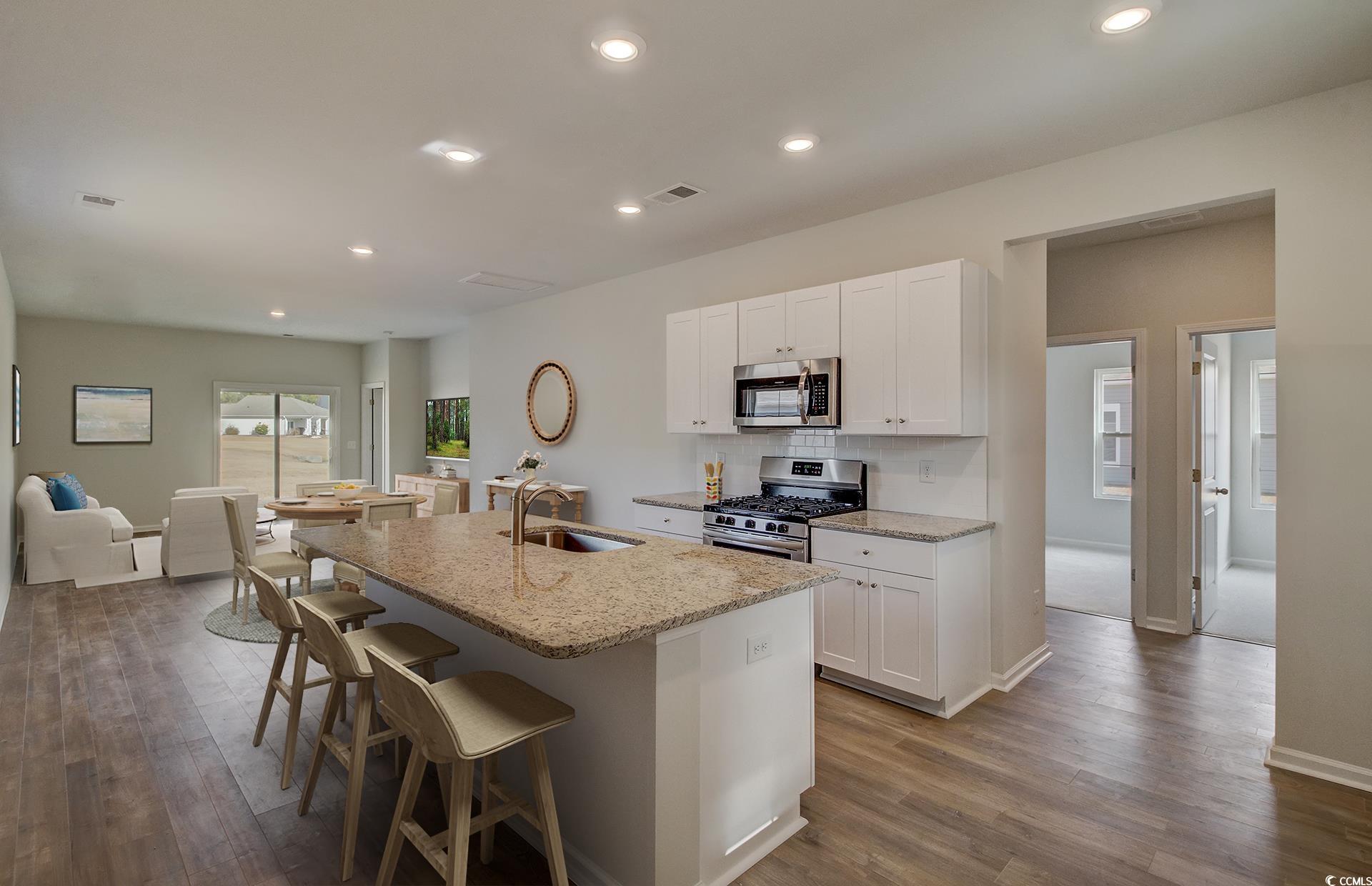 246 Warner Xing Way Loris, SC 29569 - Photo 7 of 20 Kitchen with light stone counters, stainless steel