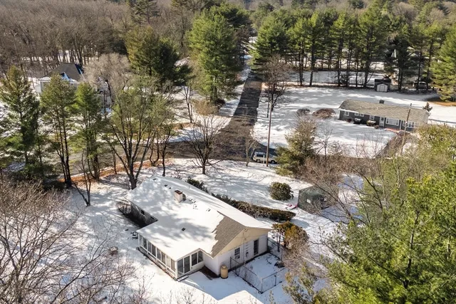 a view of a patio with wooden fence