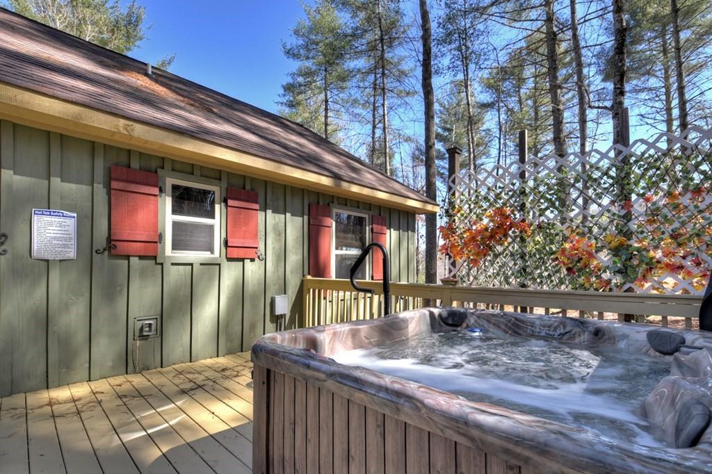 33 Carley Drive Morganton, GA 30560 - Photo 24 of 54 a patio with table and chairs and potted plants