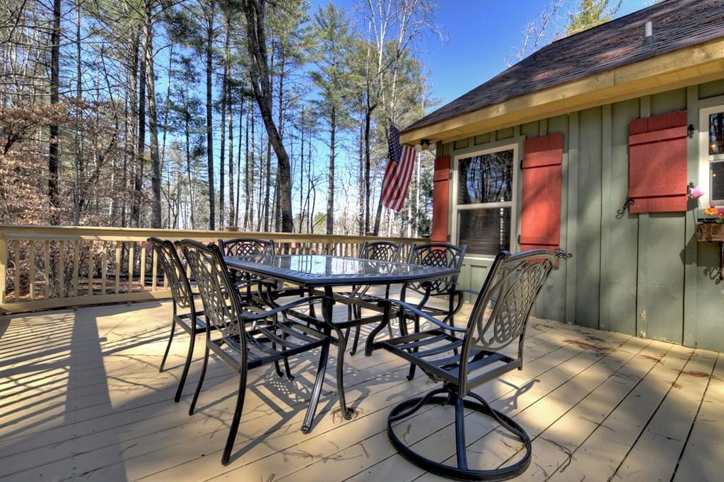 33 Carley Drive Morganton, GA 30560 - Photo 25 of 54 a view of a patio with table and chairs and wooden floor