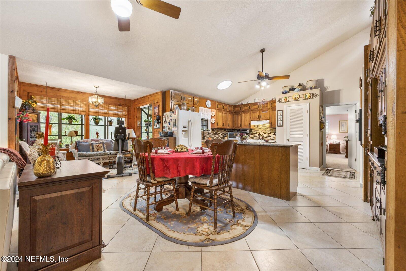 195 Horseman Club Road Palatka, FL 32177 - Photo 17 of 58 a view of a dining room with furniture