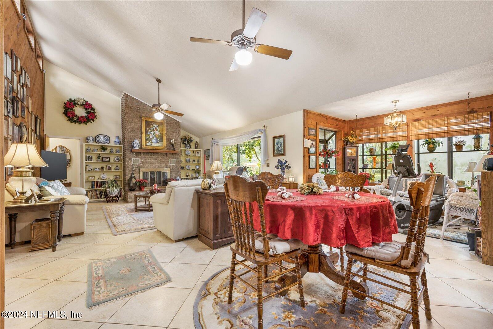 195 Horseman Club Road Palatka, FL 32177 - Photo 18 of 58 a living room with furniture kitchen view and a large window