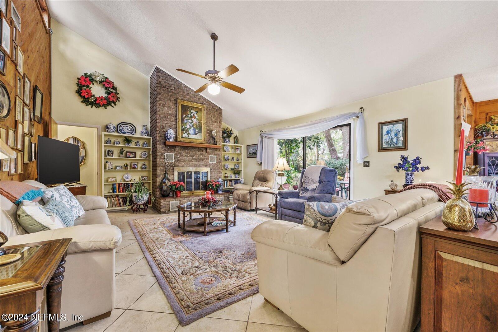 195 Horseman Club Road Palatka, FL 32177 - Photo 20 of 58 a living room with furniture fireplace and a window