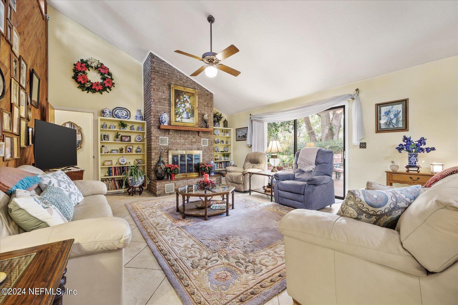 195 Horseman Club Road Palatka, FL 32177 - Photo 21 of 58 a living room with furniture and a flat screen tv