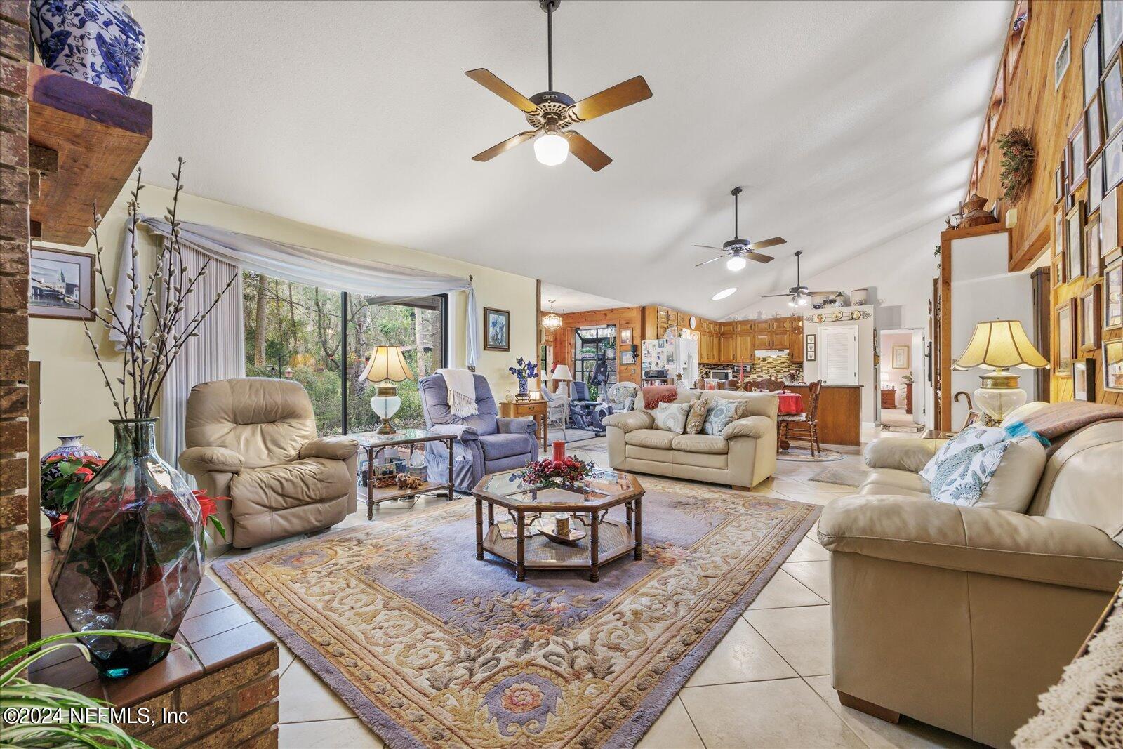 195 Horseman Club Road Palatka, FL 32177 - Photo 23 of 58 a living room with furniture or couch and a chandelier