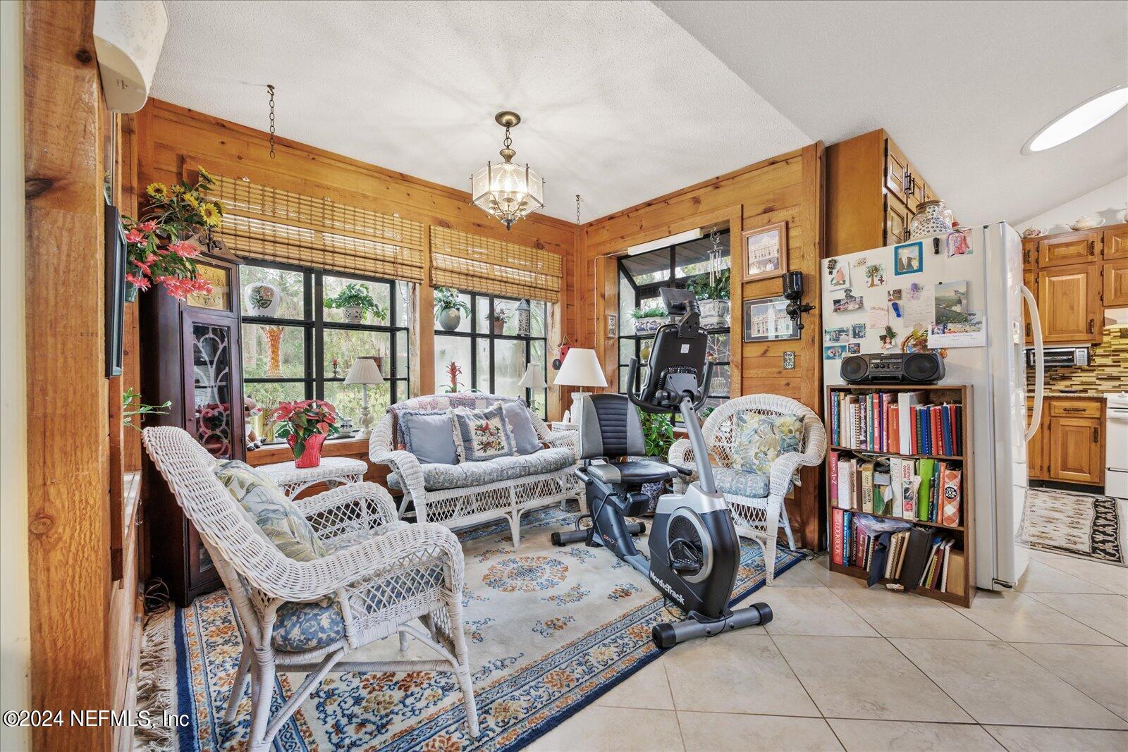 195 Horseman Club Road Palatka, FL 32177 - Photo 24 of 58 a bedroom with furniture and a large window