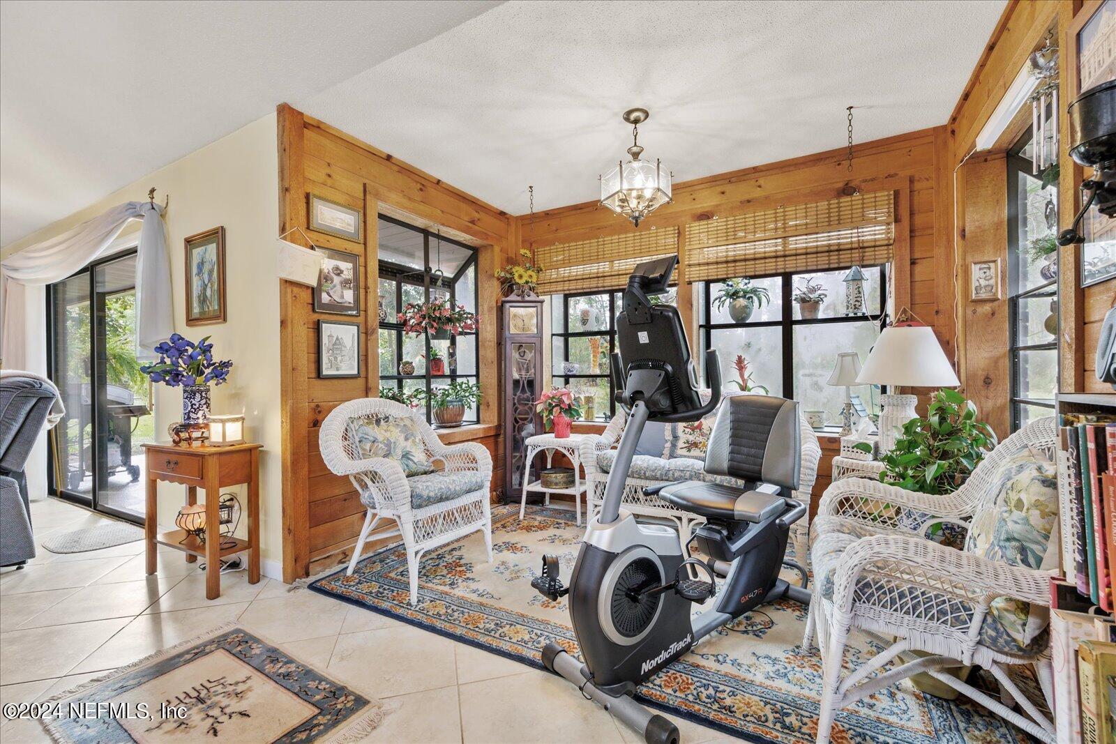 195 Horseman Club Road Palatka, FL 32177 - Photo 25 of 58 a view of a dining room with furniture a rug and wooden floor