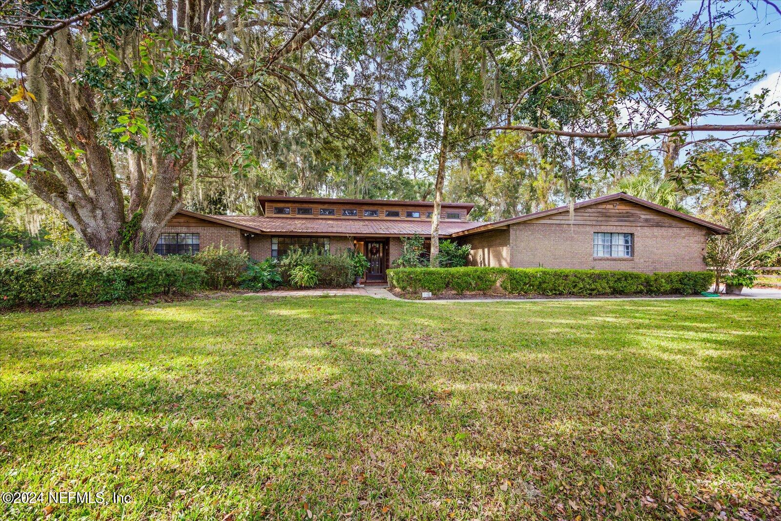 195 Horseman Club Road Palatka, FL 32177 - Photo 3 of 58 a front view of a house with a yard