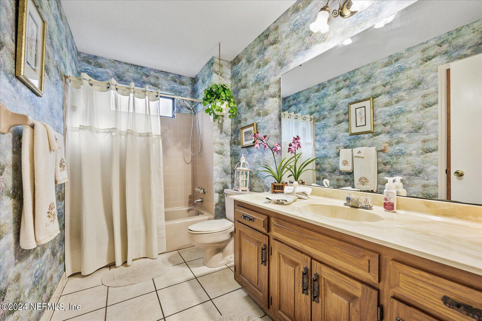 195 Horseman Club Road Palatka, FL 32177 - Photo 32 of 58 a bathroom with a sink a toilet and shower