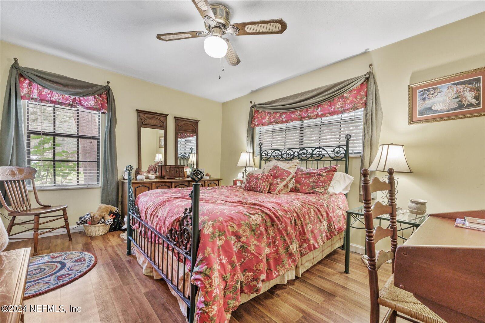 195 Horseman Club Road Palatka, FL 32177 - Photo 33 of 58 a bed room with a bed and a chandelier