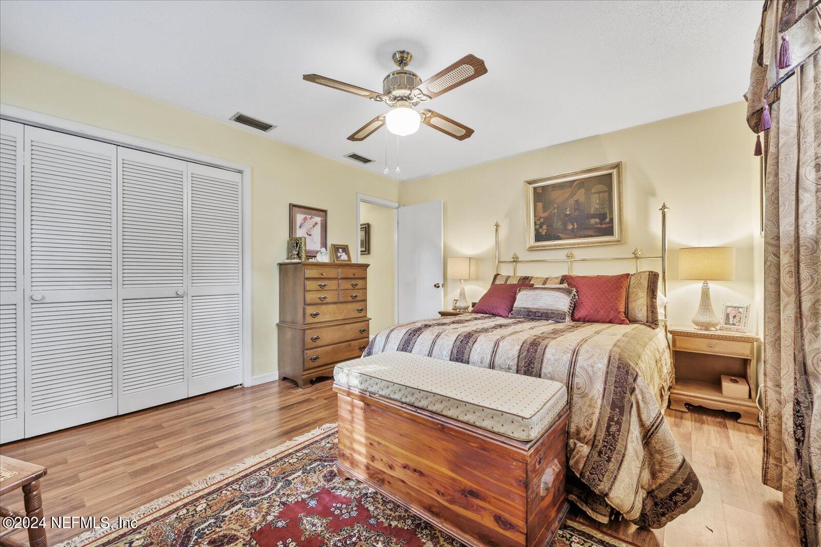 195 Horseman Club Road Palatka, FL 32177 - Photo 36 of 58 a bedroom with furniture and wooden floor