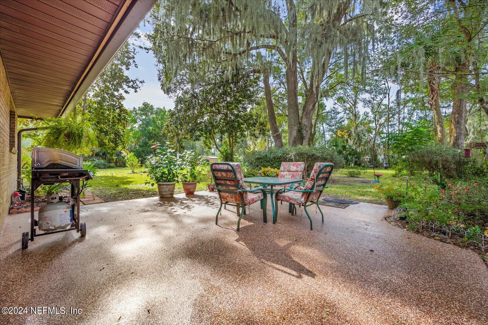 195 Horseman Club Road Palatka, FL 32177 - Photo 44 of 58 a view of a chairs and table in the patio