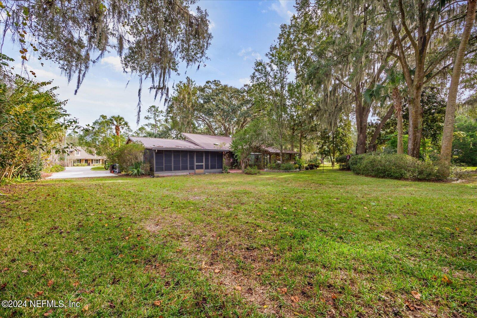195 Horseman Club Road Palatka, FL 32177 - Photo 46 of 58 a view of a house with a yard