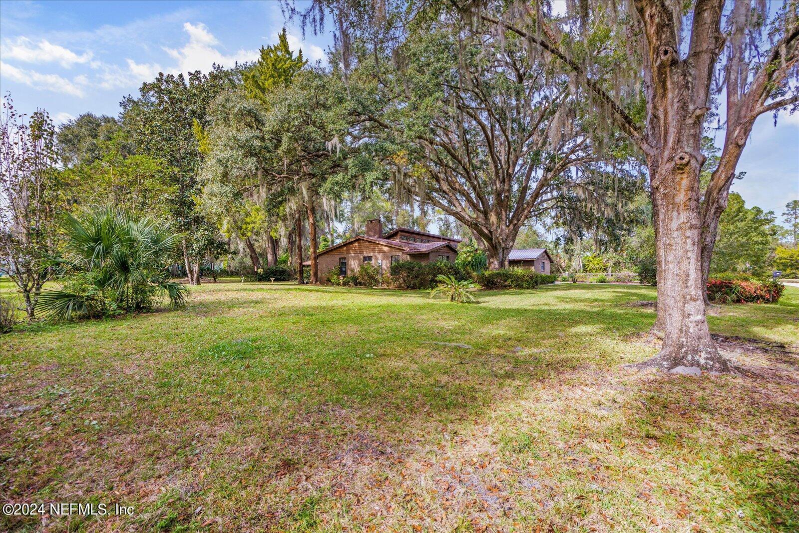 195 Horseman Club Road Palatka, FL 32177 - Photo 49 of 58 a view of a field with tree s