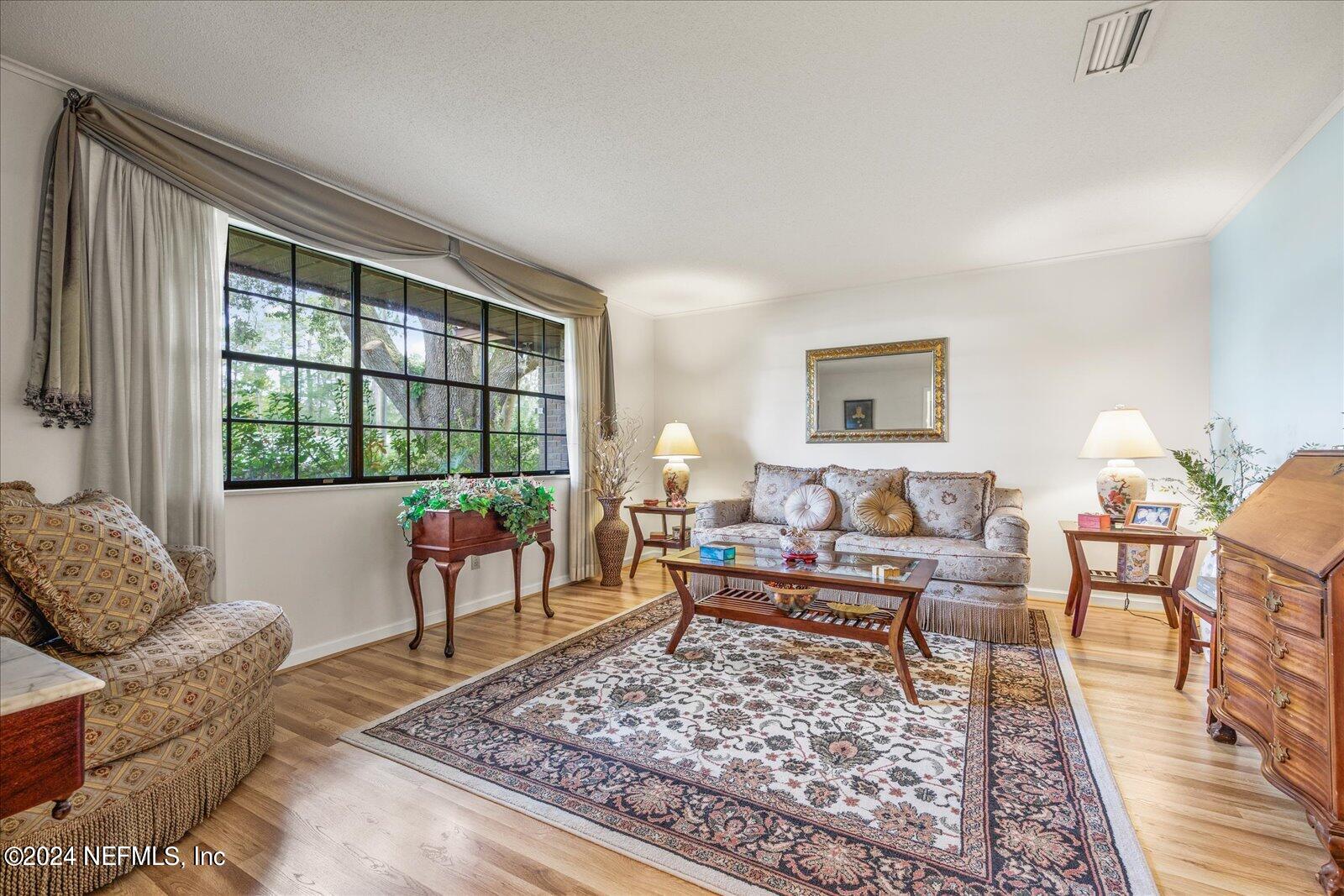195 Horseman Club Road Palatka, FL 32177 - Photo 7 of 58 a living room with furniture and a large window