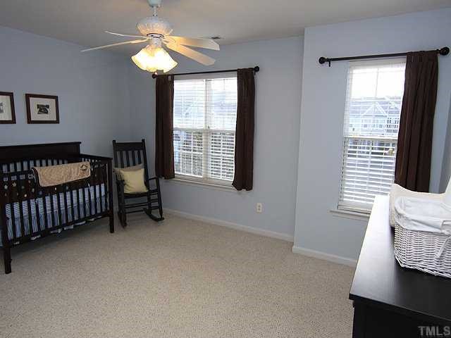 8302 City Loft Court Raleigh, NC 27613 - Photo 8 of 10 a bedroom with a bed and a window