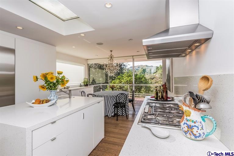 333 Manford Way Pasadena, CA 91105 - Photo 16 of 60 a living room with furniture and a floor to ceiling window
