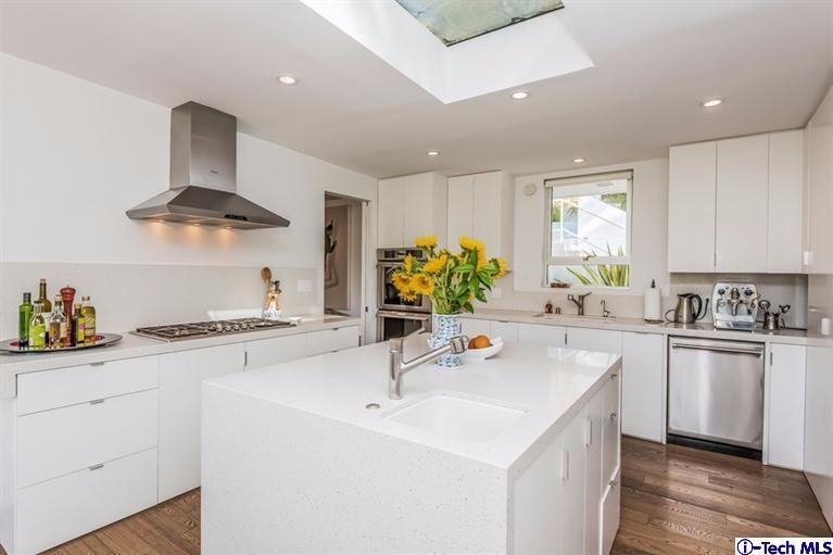 333 Manford Way Pasadena, CA 91105 - Photo 17 of 60 a kitchen with a sink a stove cabinets and counter space