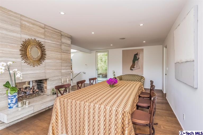 333 Manford Way Pasadena, CA 91105 - Photo 22 of 60 a bedroom with a bed and a chandelier