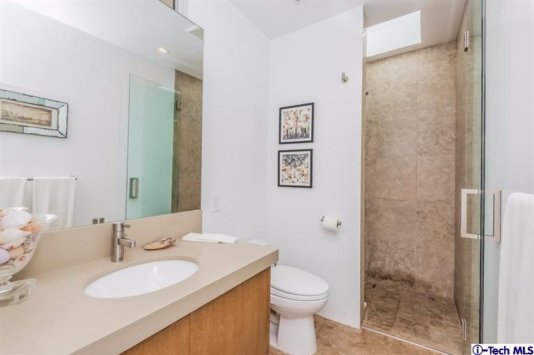 333 Manford Way Pasadena, CA 91105 - Photo 33 of 60 a bathroom with a granite countertop sink toilet and shower