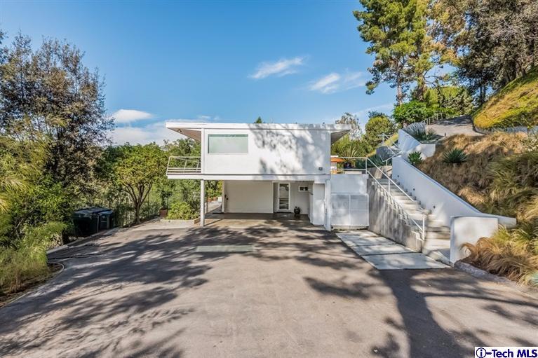 333 Manford Way Pasadena, CA 91105 - Photo 6 of 60 a view of a house with a yard