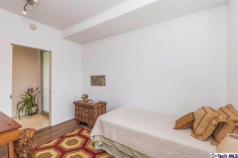 333 Manford Way Pasadena, CA 91105 - Photo 51 of 60 a bedroom with a bed and a couch