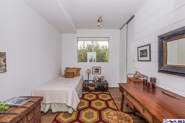 333 Manford Way Pasadena, CA 91105 - Photo 52 of 60 a bedroom with furniture and a wooden floor
