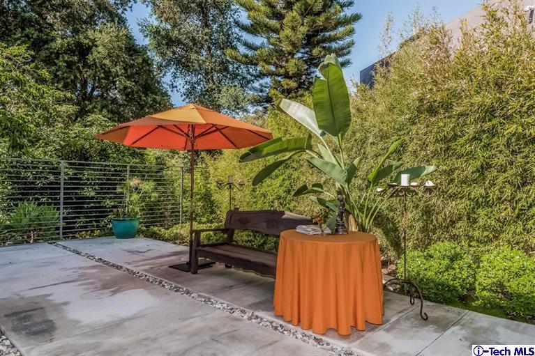 333 Manford Way Pasadena, CA 91105 - Photo 53 of 60 a view of a backyard with plants and basketball court