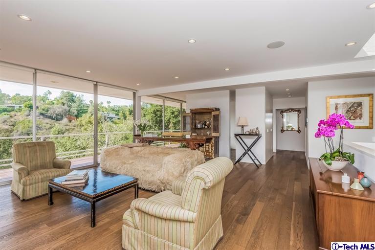 333 Manford Way Pasadena, CA 91105 - Photo 8 of 60 a living room with furniture large window and wooden floor
