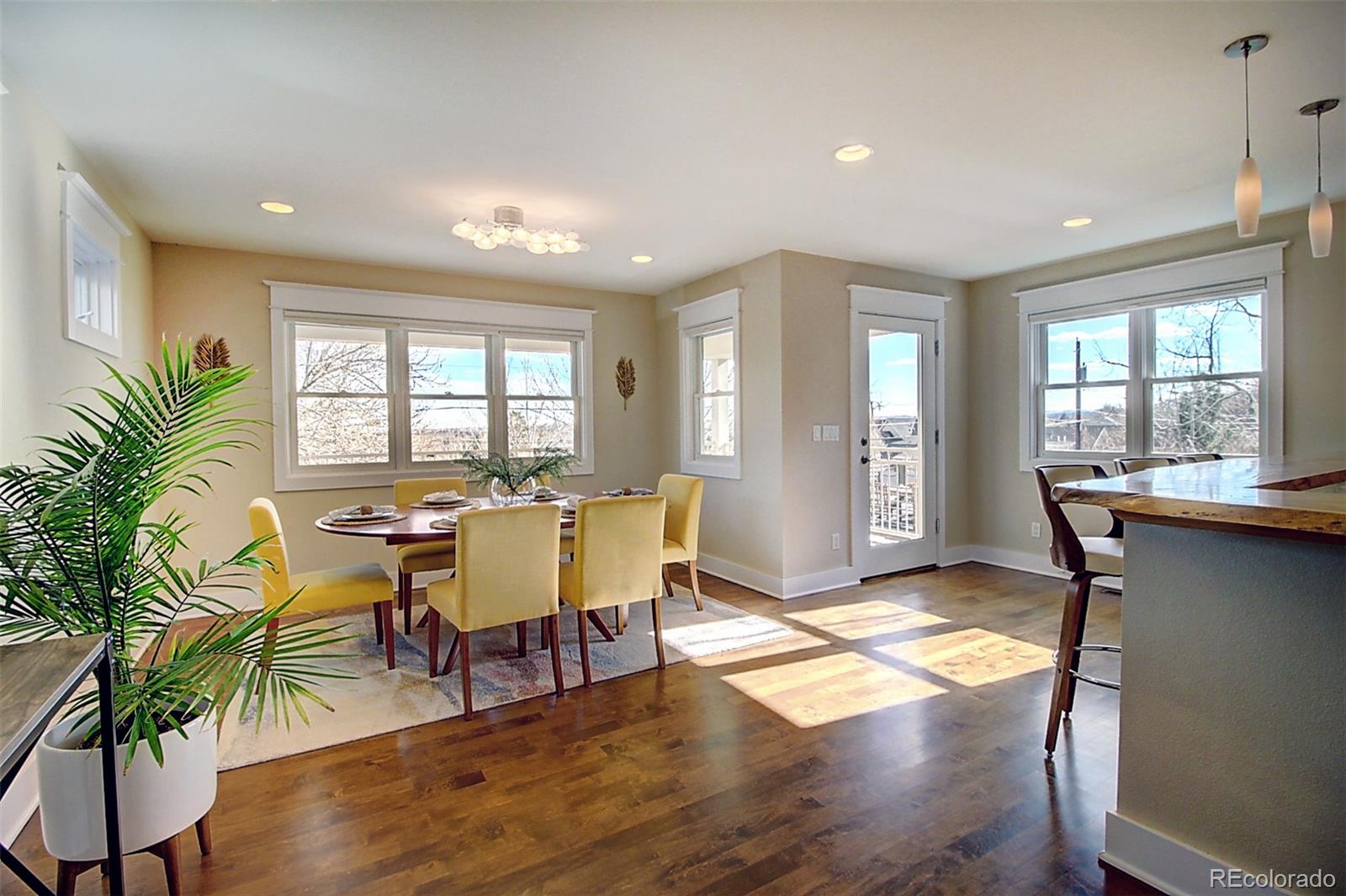 2942 4th Street Boulder, CO 80304 - Photo 11 of 22 a view of a dining room with furniture window and wooden floor