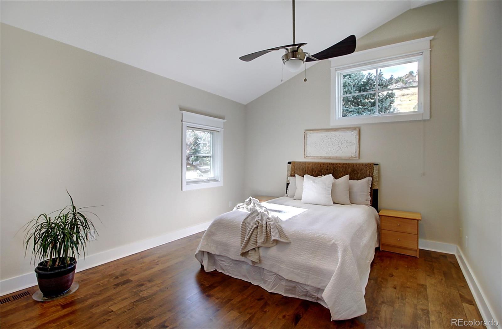 2942 4th Street Boulder, CO 80304 - Photo 15 of 22 a bedroom with a bed and wooden floor