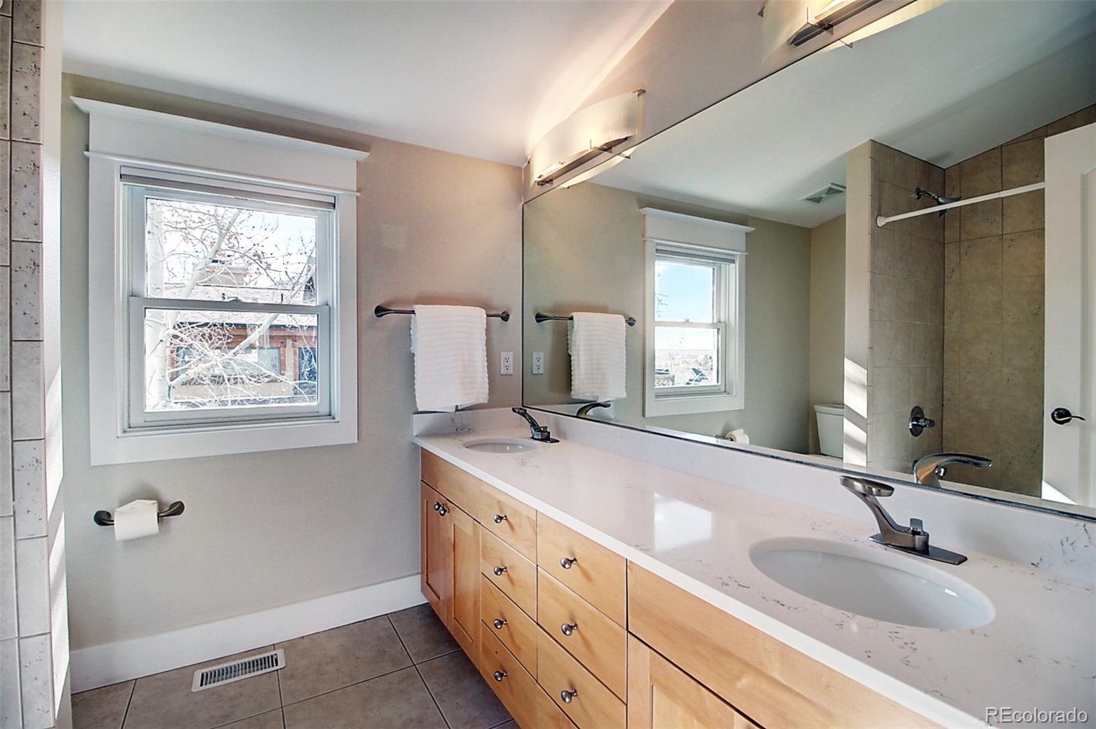 2942 4th Street Boulder, CO 80304 - Photo 17 of 22 a bathroom with double vanity and a mirror