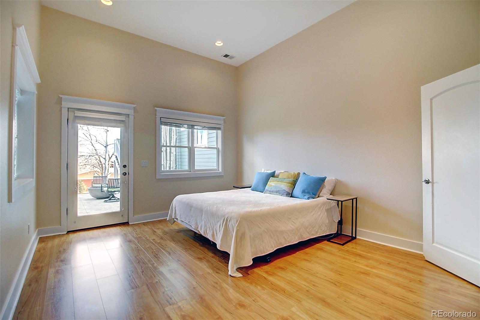2942 4th Street Boulder, CO 80304 - Photo 21 of 22 a bedroom with a bed and wooden floor