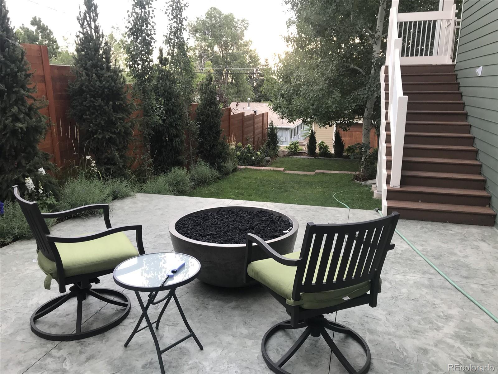 2942 4th Street Boulder, CO 80304 - Photo 22 of 22 a view of a chairs and table in backyard of the house