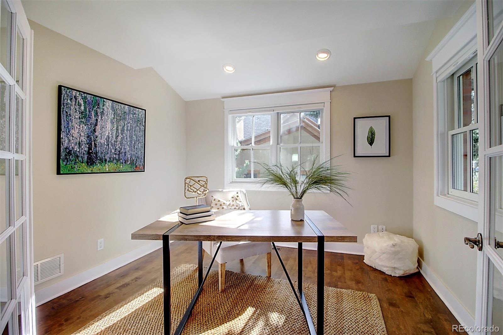2942 4th Street Boulder, CO 80304 - Photo 7 of 22 a view of a workspace with furniture and a potted plant