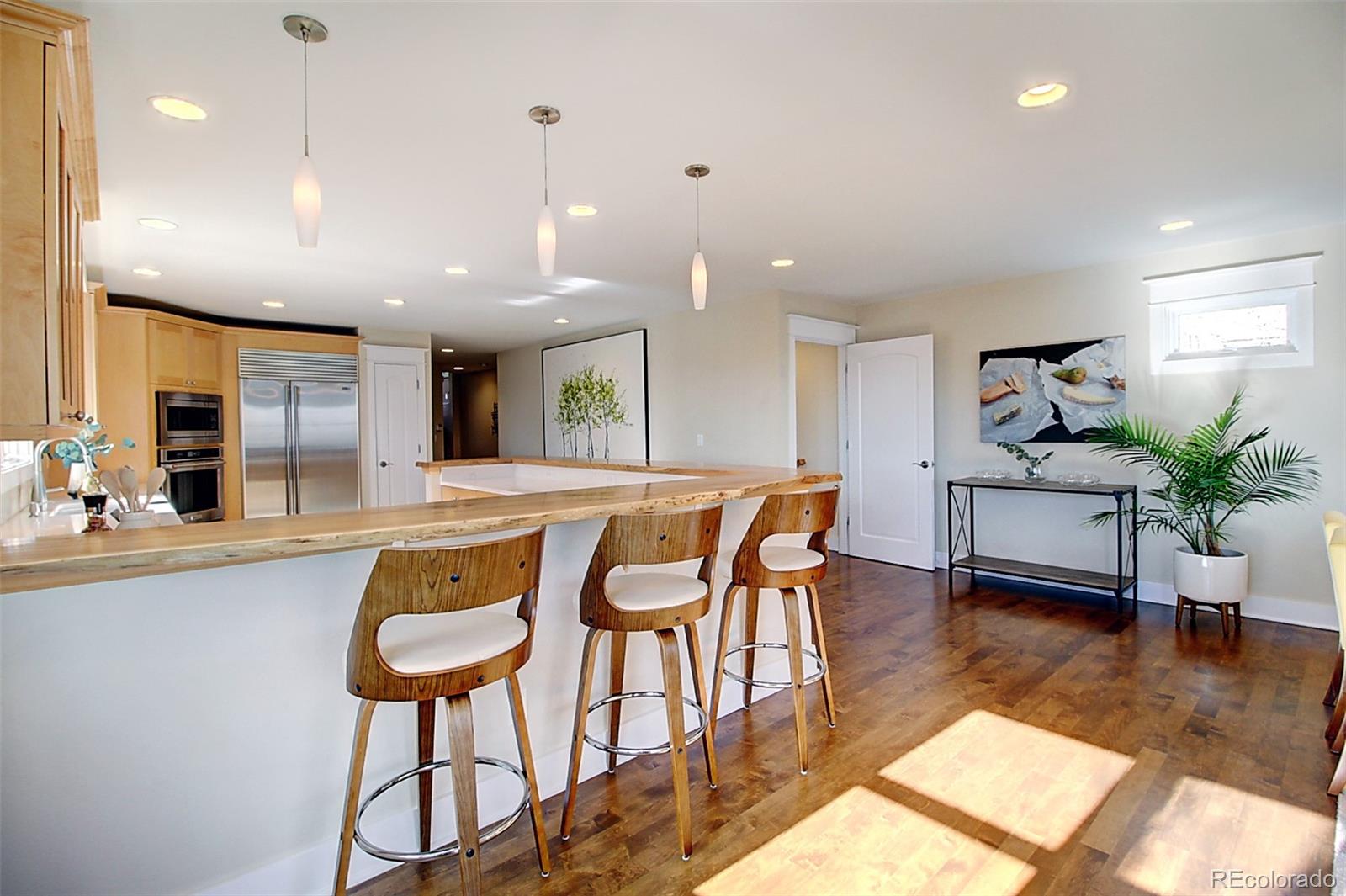 2942 4th Street Boulder, CO 80304 - Photo 9 of 22 a kitchen with stainless steel appliances granite countertop counter space a sink and a refrigerator