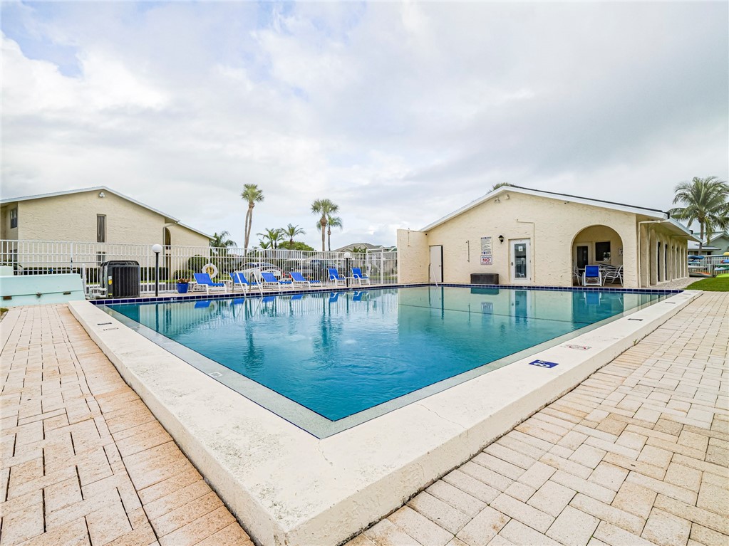 1860 Robalo Drive, Unit 105A Vero Beach, FL 32960 - Photo 26 of 35 a view of swimming pool with a lake view