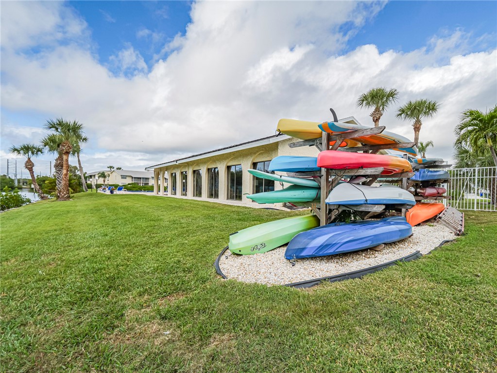 1860 Robalo Drive, Unit 105A Vero Beach, FL 32960 - Photo 27 of 35 a front view of house with yard and entertaining space