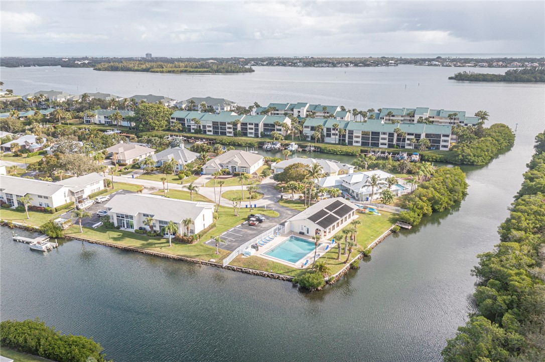 1860 Robalo Drive, Unit 105A Vero Beach, FL 32960 - Photo 29 of 35 a picture of a city and lake view