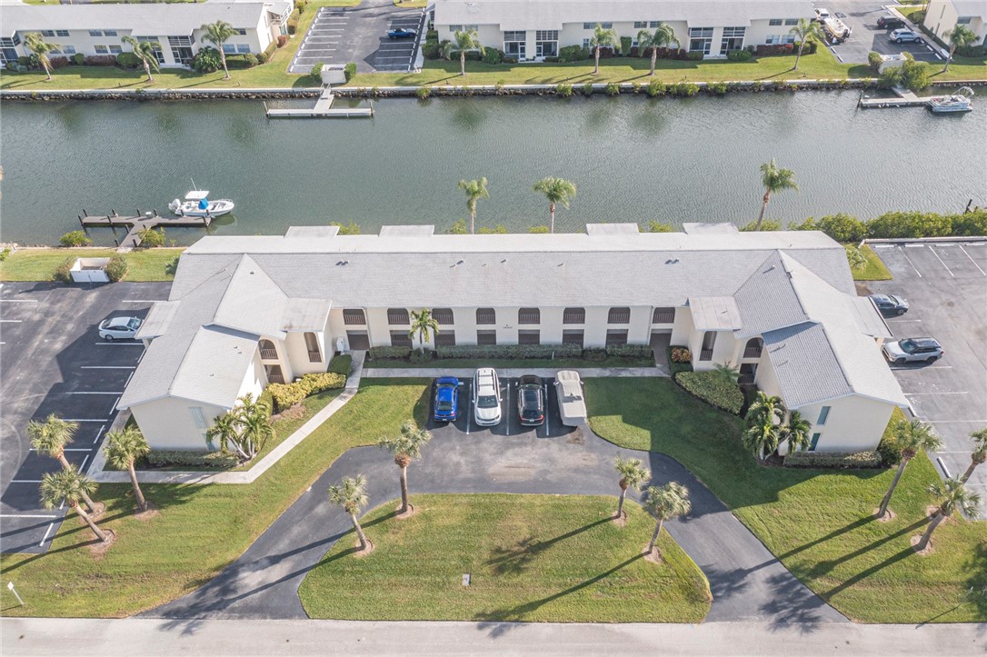 1860 Robalo Drive, Unit 105A Vero Beach, FL 32960 - Photo 30 of 35 an aerial view of a house with a lake view