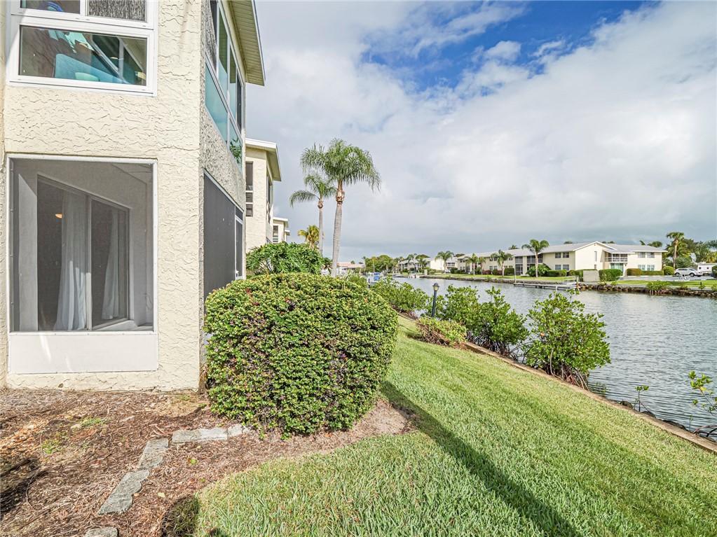 1860 Robalo Drive, Unit 105A Vero Beach, FL 32960 - Photo 32 of 35 a view of a yard with plants